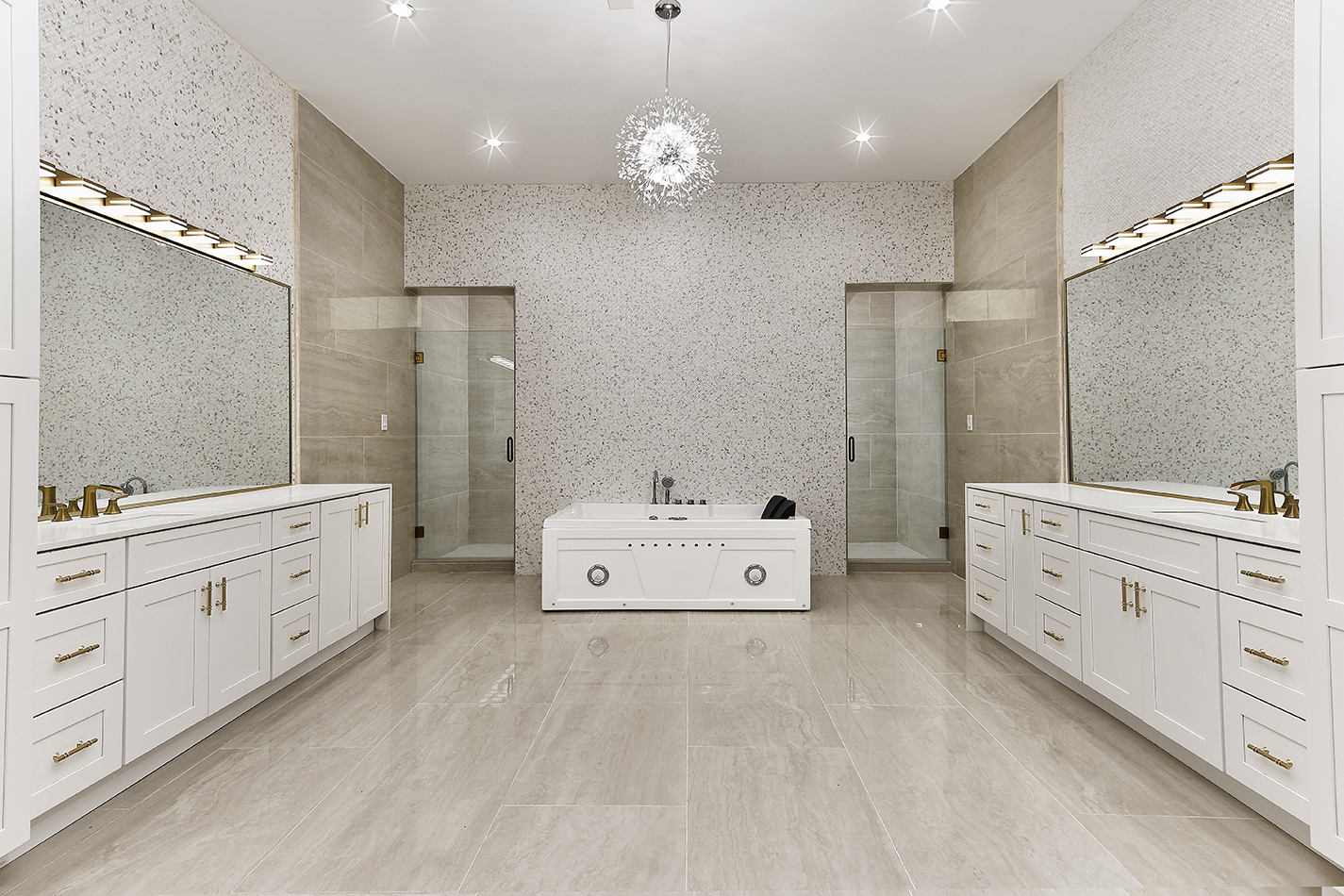 Primary bath with soaking tub, dual vanities, and twin showers