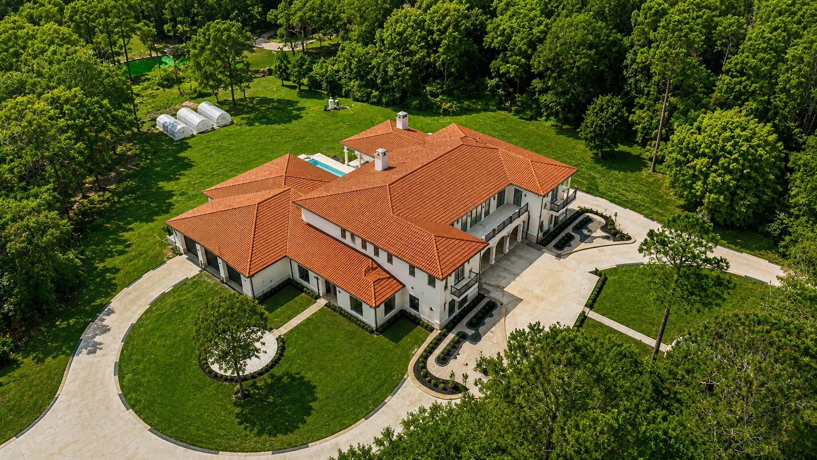 Angled aerial of the rear of the home and pool