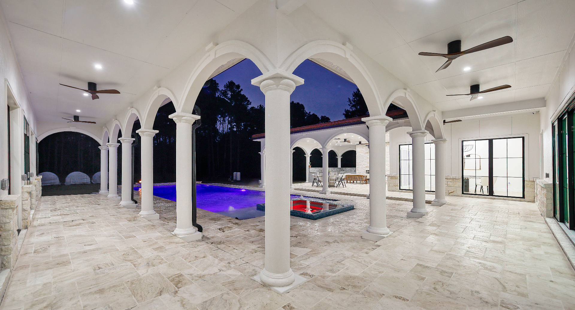 Sweeping loggia of Mediterranean arches overlooking the pool